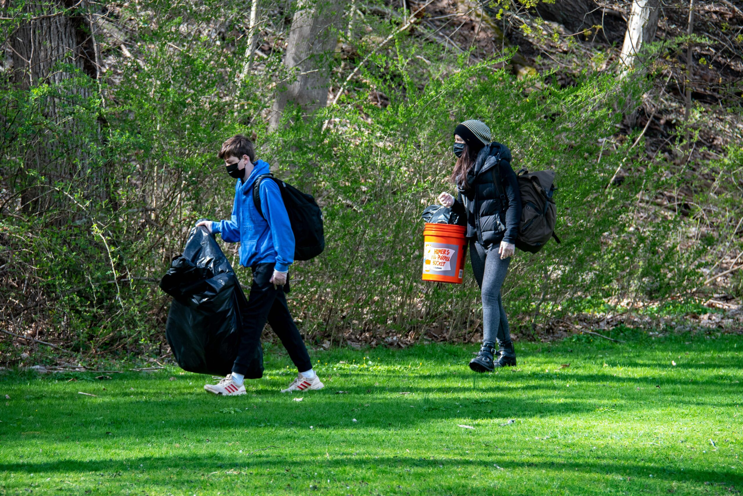 People cleaning terrain